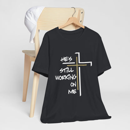 He's Still Working On Me - Unisex Jersey Short Sleeve Tee