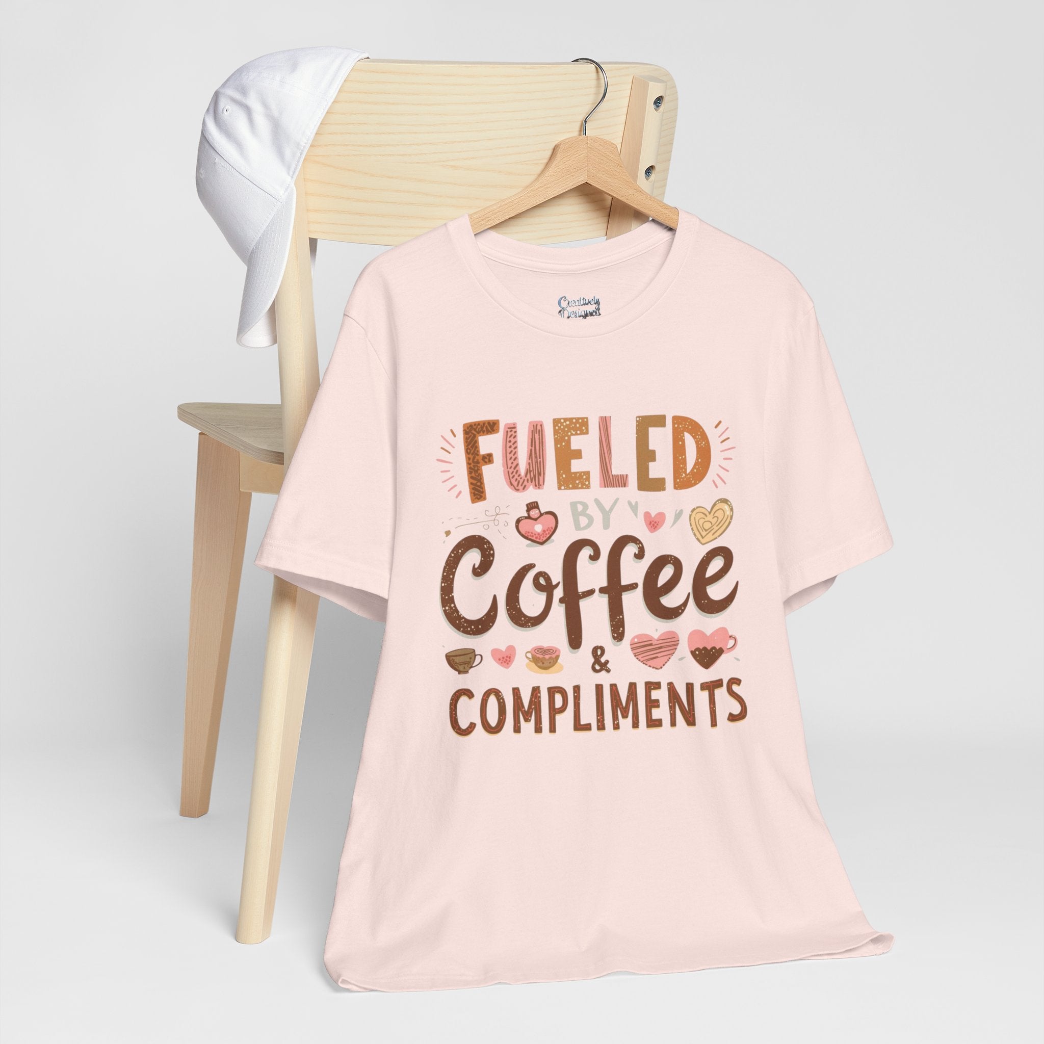 Fueled by Coffee & Compliments – Unisex Tee